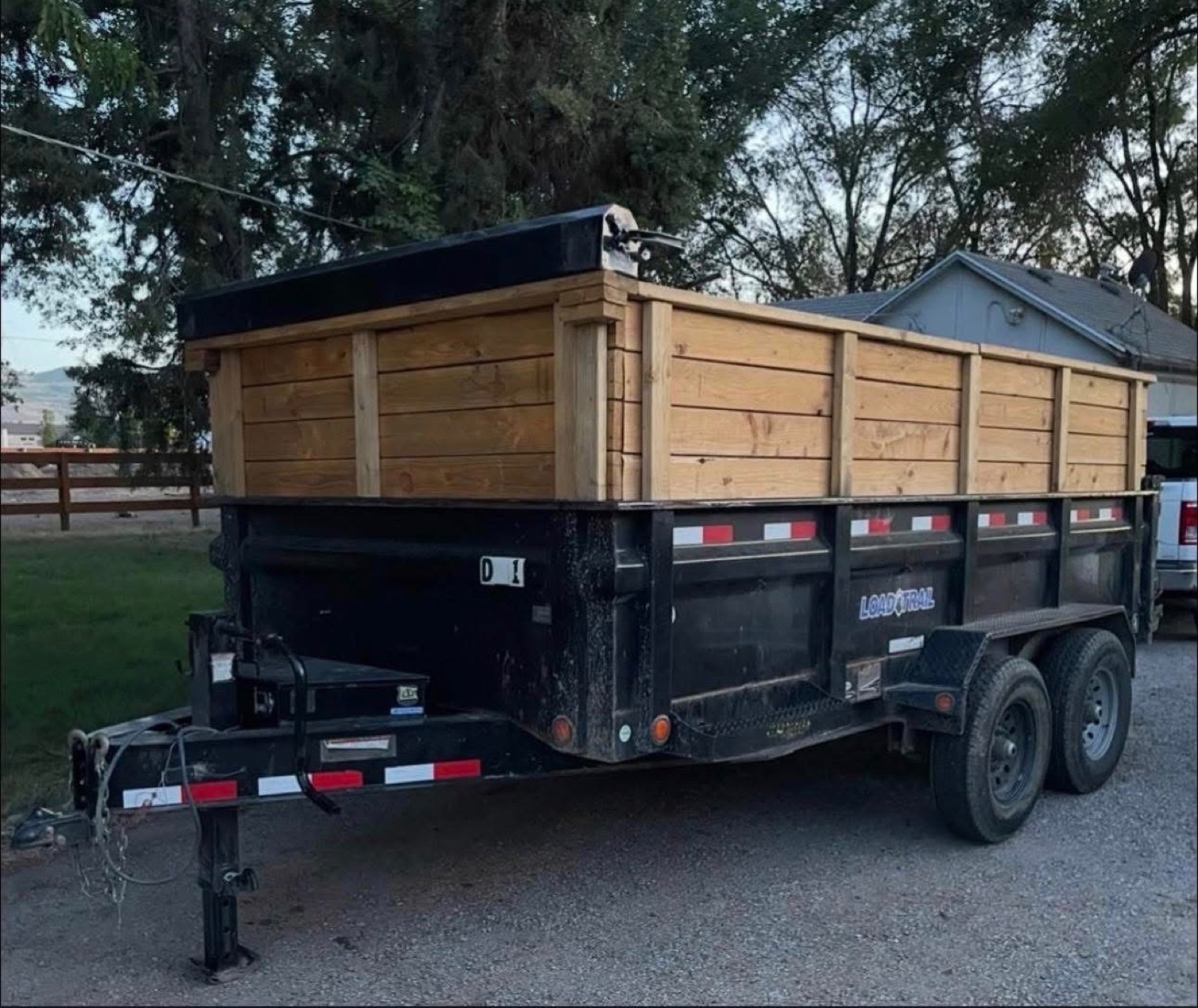 Large dump trailer with wood sides for haul-off jobs